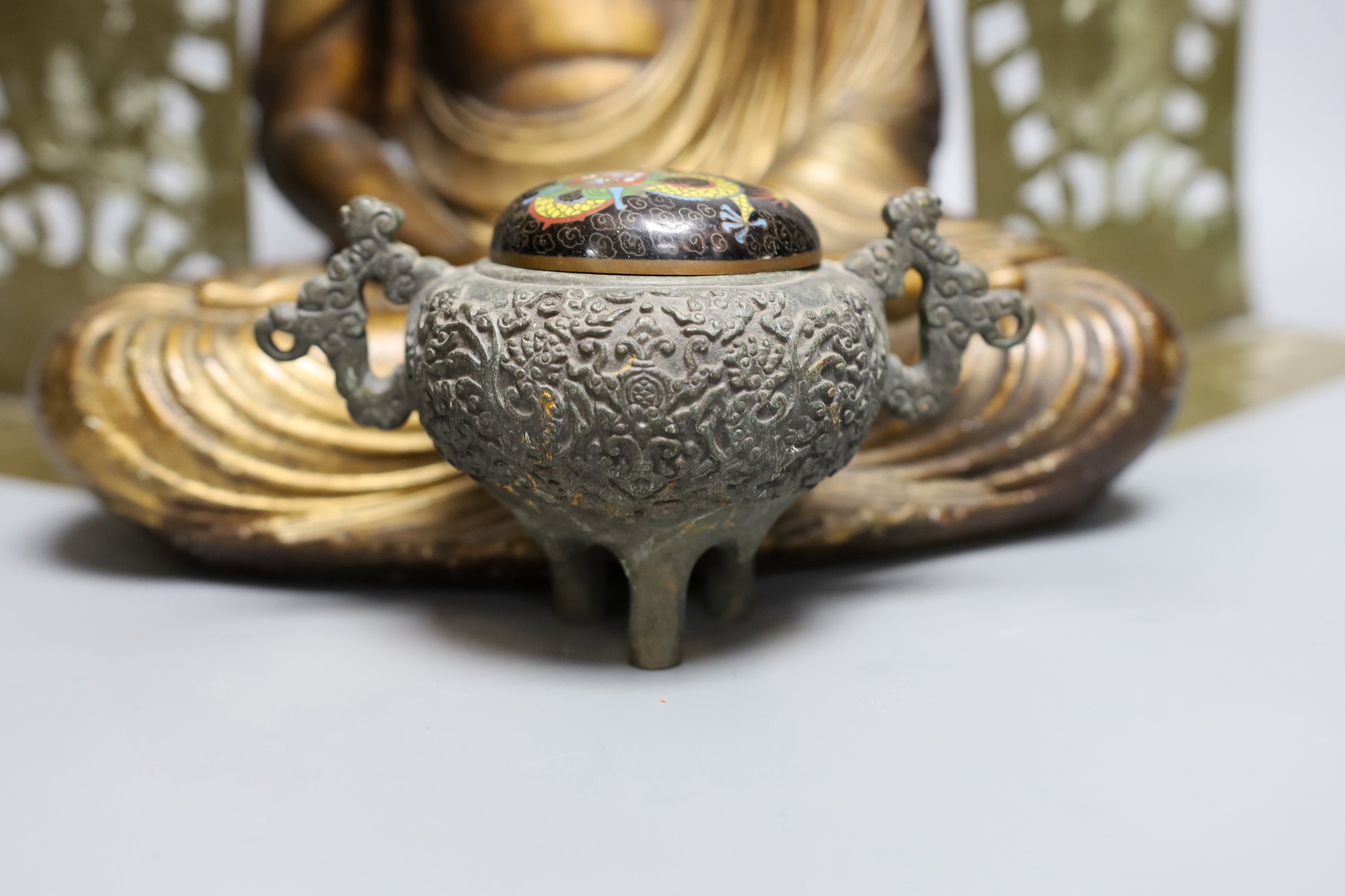Assorted Chinese items, to include a bronze tripod censer, an enamel dragon cover, a lacquered seated Buddha, 34cm tall, and book ends (5)